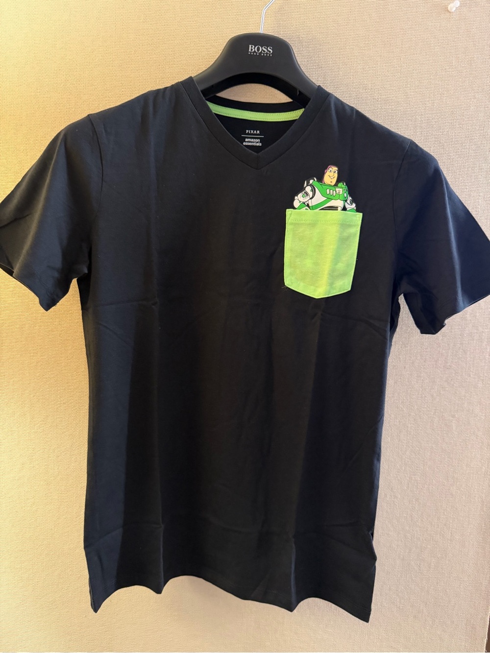 Amazon Essentials Black Tee with Neon Green Pocket and Buzz Design
